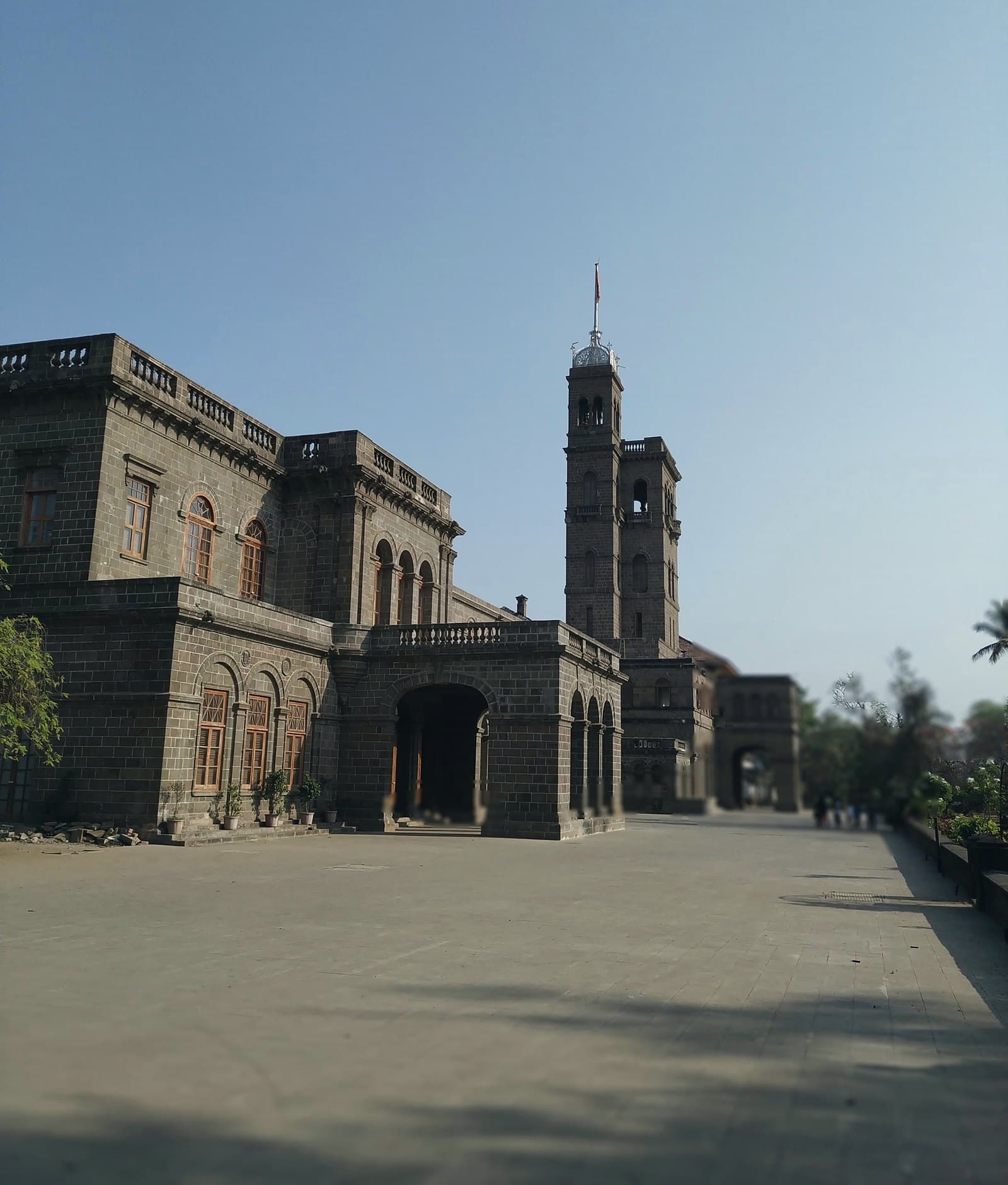 The main building of Savitribai Phule Pune University under a clear sky